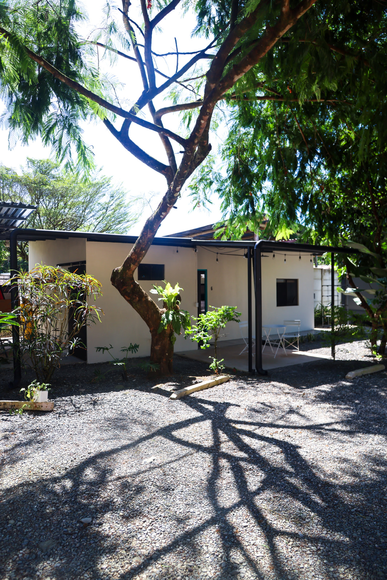 Eco Apartments Uvita — Casita 6 and shaded garden terrace